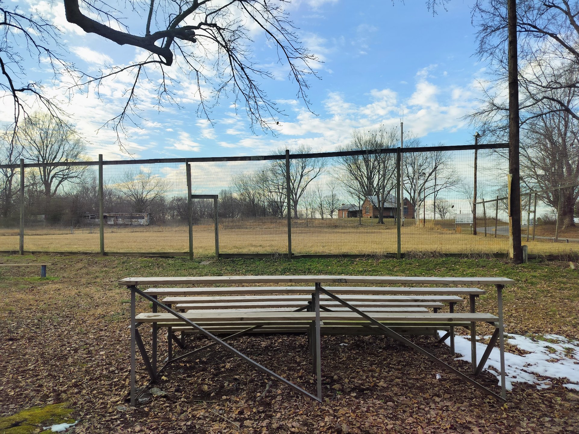 Baseball field with bleachers and backstop